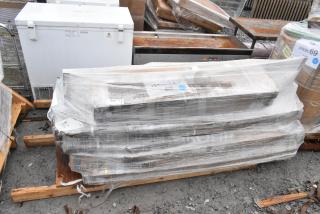 Five new scratch and dent items, including a wire shelf and U boat cart, wrapped in plastic. Tags show "FEB26-125."