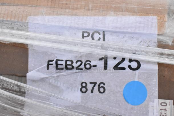 Label reading "PCI FEB26-125 876" on wrapped package of 5 brand new scratch and dent items including a wire shelf and utility cart.