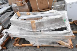 Two brand new scratch and dent items wrapped on pallet, including a sink and pot rack. Packaging intact, auction lot FEB26-96.
