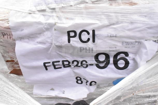 Brand new scratch and dent items including sink and pot rack, wrapped with Feb26-96 tag visible.