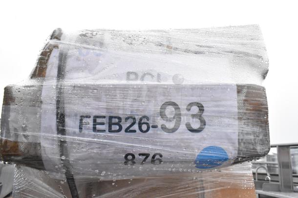 Bundle of 7 scratch and dent items, including a traffic door and bi-fold table, wrapped in plastic; label reads "FEB26-93".