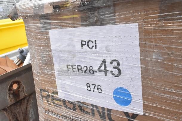 Pallet wrapped with label reading "PCI FEB26-43," containing 5 brand new scratch and dent products including a Regency table.