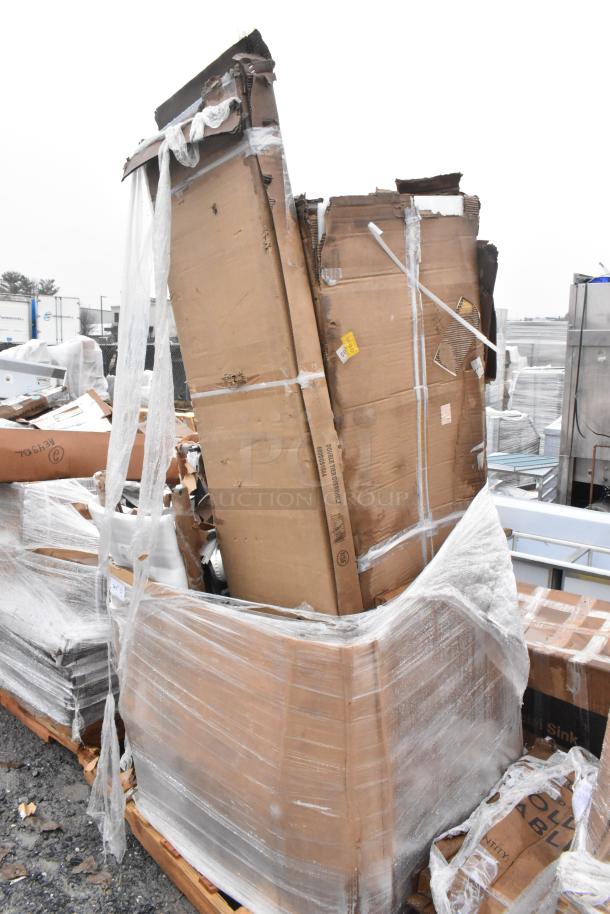 9 new scratch and dent items, including a chair, sink, and overshelf, packaged in visible cardboard boxes and plastic wrap.