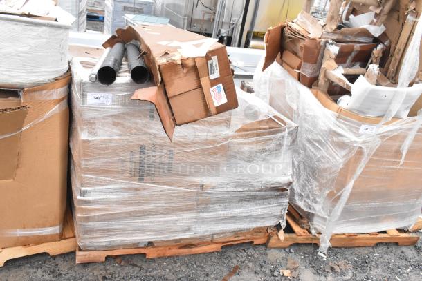 Sealed pallets with 18 new scratch and dent items, including table bases. Boxes are partially damaged. Labels and pipes visible.