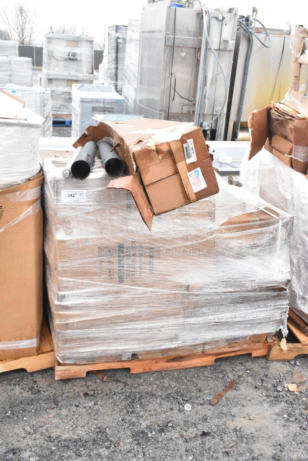 18 brand new scratch and dent items on a pallet, including table bases, wrapped in plastic. Damaged boxes visible.