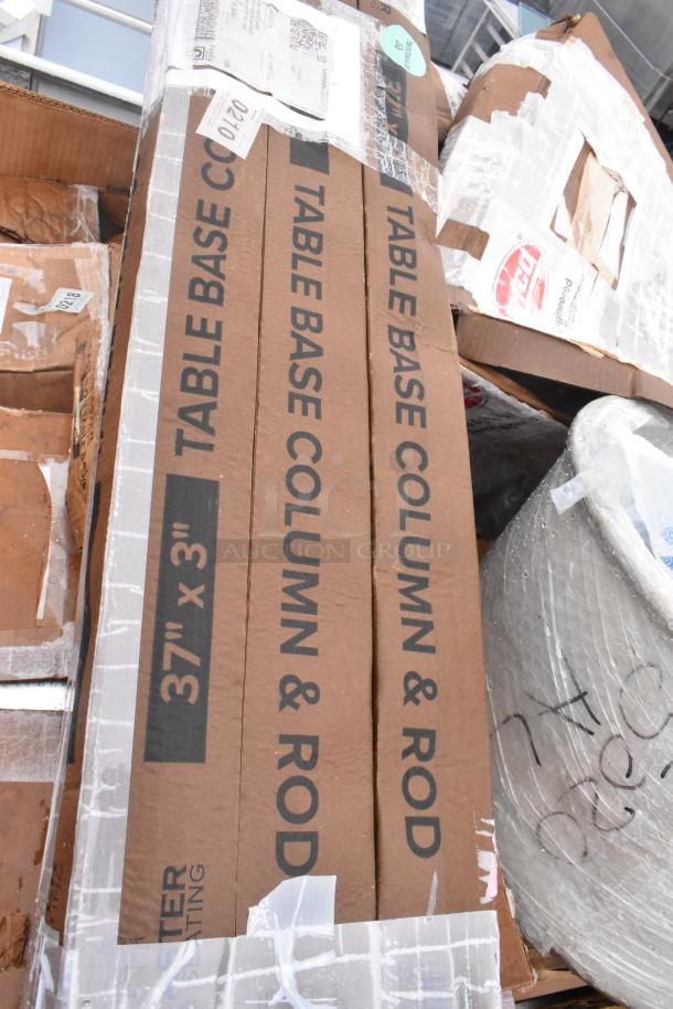 Cardboard boxes labeled "Table Base Column & Rod, 37'' x 3''." Items are new with minor dents. Includes sink, grease trap.