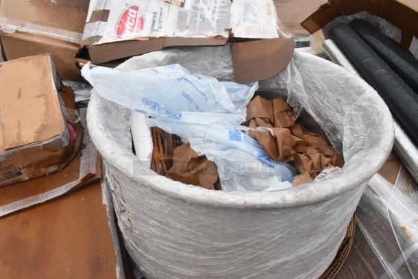 Bundle of 15 new scratch and dent items including a sink and grease trap, wrapped in packaging with visible cardboard boxes.