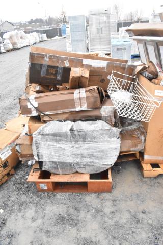 12 brand new scratch and dent items including table base columns, sink, and pot rack on pallets outdoors.