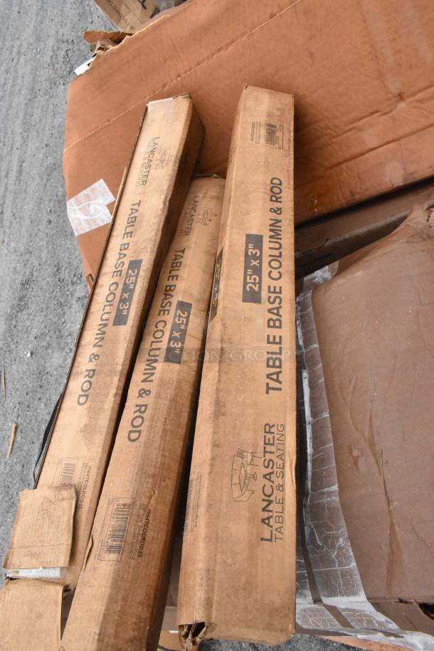 Boxes of Lancaster Table Base Column & Rods, 25"x3", visible. Condition appears scratch and dent.