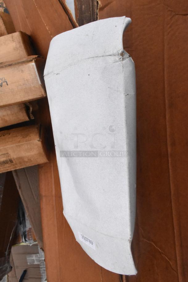 New scratch and dent item, likely a table base column, with visible packaging damage and item code 300789.