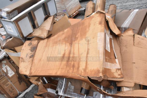 Twelve new scratch and dent items, including table base columns, sink, pot rack. Items show packaging damage.