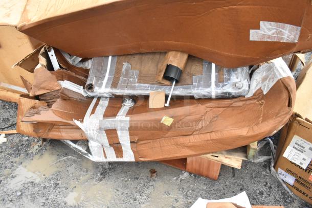 12 scratch and dent items, including table base columns, sink, and pot rack. Mixed in crumpled packaging.