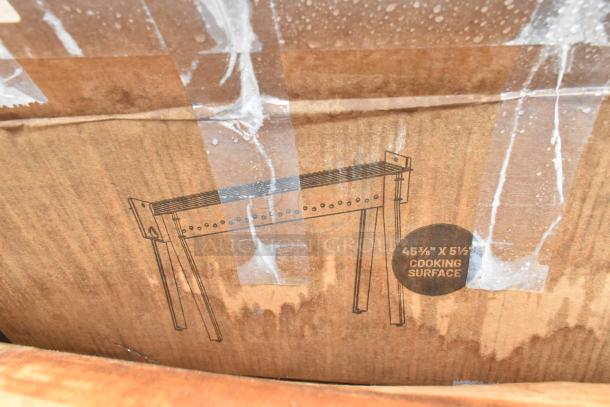 Cardboard box with printed image of a table base, labeled "45⅜” x 5½” Cooking Surface,", new condition.