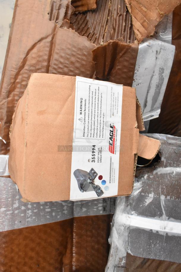 Box labeled "Eagle Group 355994" for a foot valve, single pedal. Packaging shows wear, indicating scratch and dent condition.