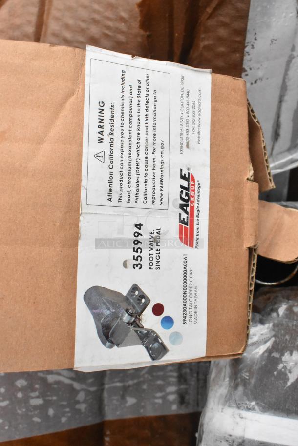 Box showing Eagle Group logo and warning label. Contains foot valve, single pedal model 355994. New condition.