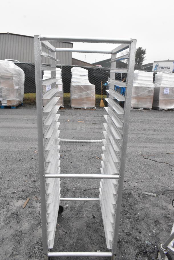 Lockwood RA64-ER18E-S pan transport rack with commercial casters. Good condition, sturdy metal frame, multiple shelving slots.