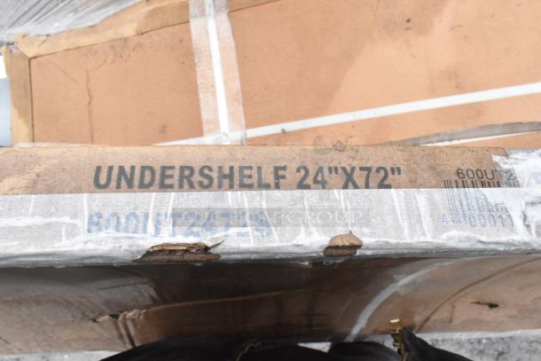Regency 600UT2472S undershelf for 24"x72" tables, 18-gauge stainless steel, marked and partially packaged.