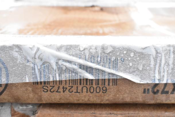 Regency stainless steel table undershelf and dish cabinet in packaging with visible model numbers, wrapped for protection.