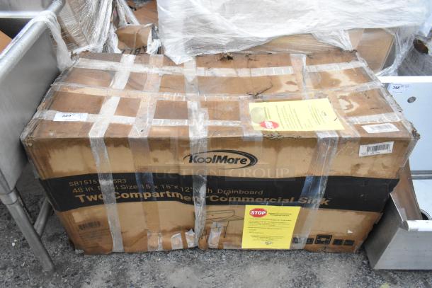 Boxed KoolMore SB151512-15R3, 48" two-compartment stainless steel sink with drainboard. New, scratch and dent condition.