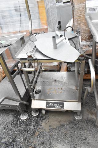 Face to Face commercial meat slicer equipment stand, stainless steel, on wheels, worn surface, "Face to Face" label visible.