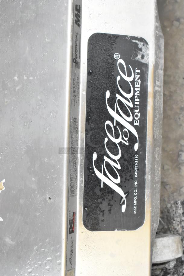 Face to Face Commercial Meat Slicer Equipment Stand with visible branding; appears in used condition with wear marks.