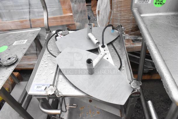 Face to Face commercial meat slicer equipment stand; stainless steel, sturdy frame, moderate wear, suitable for heavy-duty use.