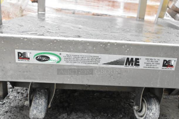 Face to Face Commercial Meat Slicer Equipment Stand with wheels, stainless steel, features M&E Mfg. Co. and patent labels.