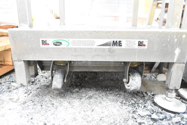 Face to Face Commercial Meat Slicer Equipment Stand with caster wheels, metal frame, and visible brand markings.