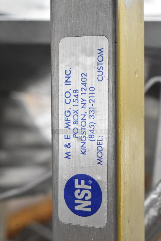 Face to Face Commercial Meat Slicer Stand with NSF certification and M & E Mfg. Co. label, indicating custom model.