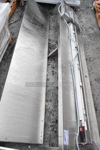 Two Hatco GRAHL-18D/HL-66 Glo Ray Strip Warmers, 120V, 1 Phase, stainless steel, with attached power cords, auction label visible.