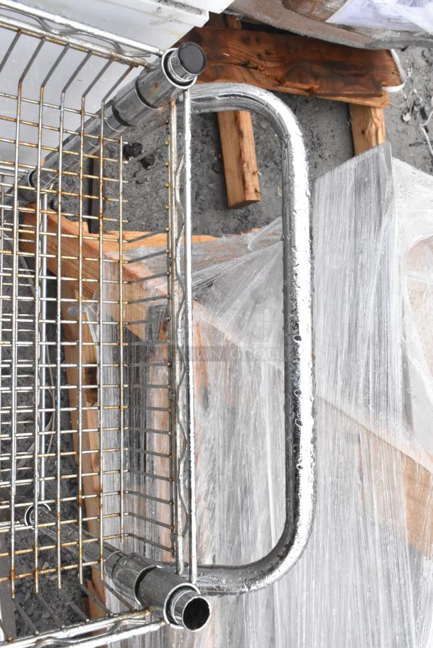 Chrome finish 3-tier wire shelf cart with commercial casters; sturdy design, slight wear on chrome, ideal for storage.