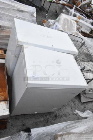 Two Haier chest freezers, models HF50CM23NW and HF71CL53NW, 115 volts, 1 phase, visible labels, moderate wear.