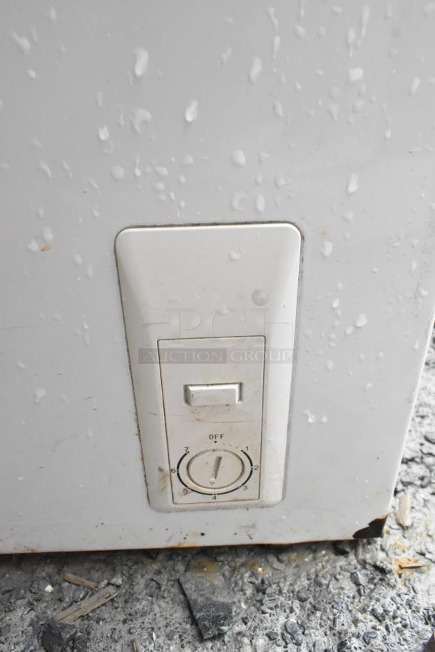 Control panel of Haier HF50CM23NW/HF71CL53NW chest freezer. Features dial with settings 0 to 7, slight wear visible.