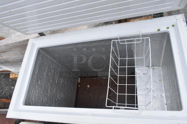 Haier HF50CM23NW/HF71CL53NW chest freezer, open lid, white wire basket, moderate wear, 115V, 1 phase.