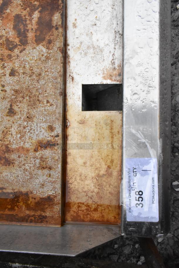 Avantco 177CAG60TG 60" gas griddle, visible rust and wear, auction tag reads "358." Thermostatic controls, 175,000 BTU.