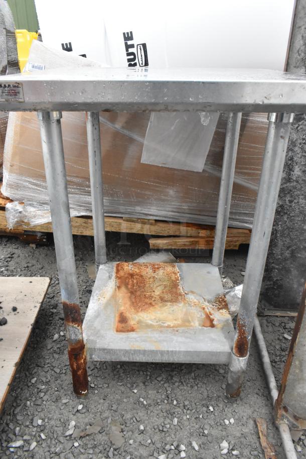 Commercial metal table with under shelf, showing rust on legs and shelf. MSSP Inc. label indicates model and origin. Fair condition.