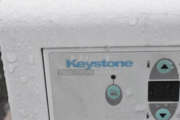 Keystone KSTAW25C window air conditioner, wet exterior, visible control panel, 208/230V, 1 Phase.
