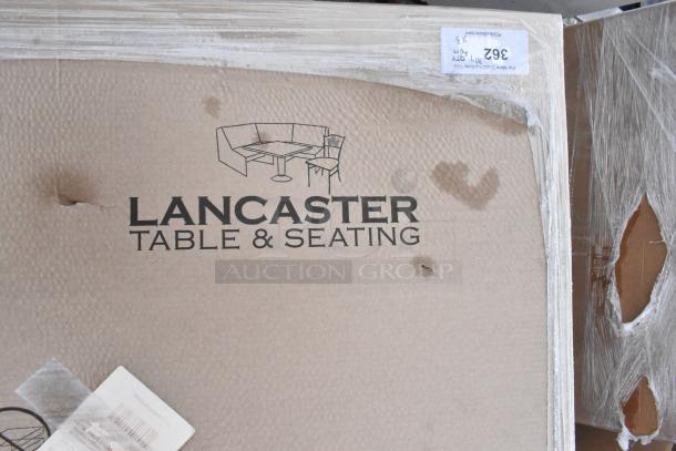 Lancaster Table & Seating packaging with visible dents and scratches, indicating new scratch and dent outdoor tables.