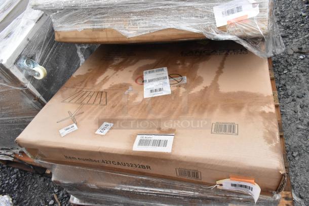 Three brand new outdoor tables with scratch and dent. Boxes marked "Lancaster Tables & Seating," item number 427CAU3232BR.