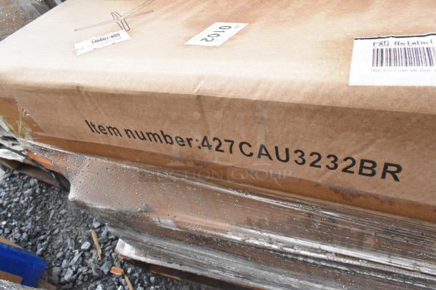 Cardboard box with item number 427CAU3232BR, labeled as new scratch and dent, includes outdoor tables.