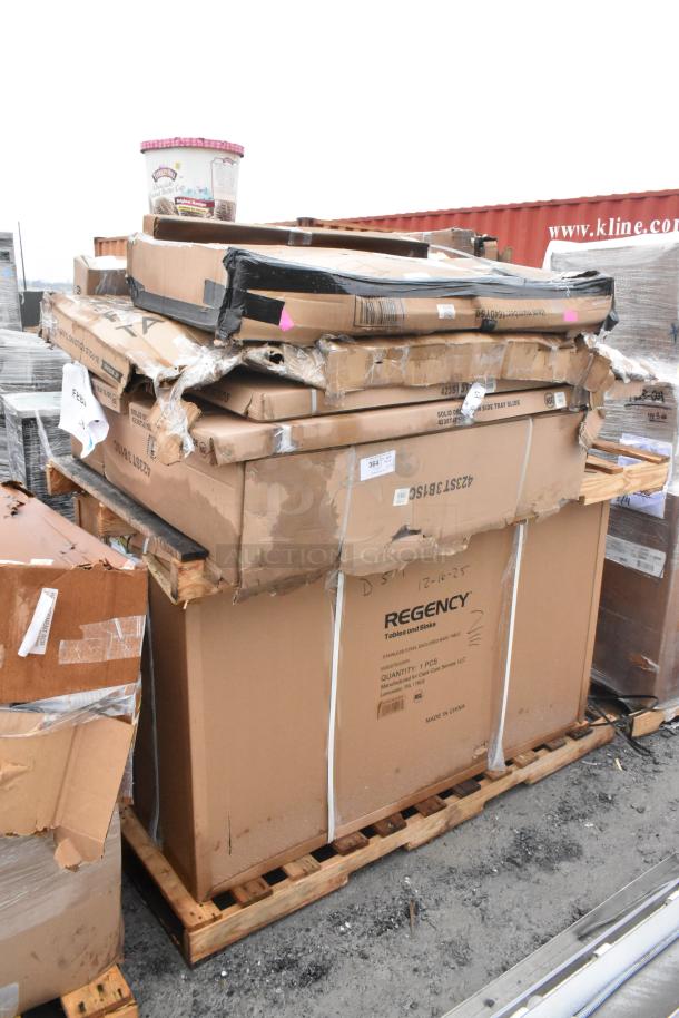 Pallet of 12 brand new scratch and dent items, including a Regency work table and tray slide in original packaging.