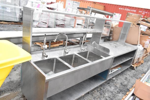 Commercial prep station featuring a 3-bay sink, single bay hand sink, under and over shelves, stainless steel, used condition.