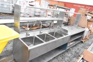 Commercial prep station featuring a 3-bay sink, single bay hand sink, under and over shelves, stainless steel, used condition.