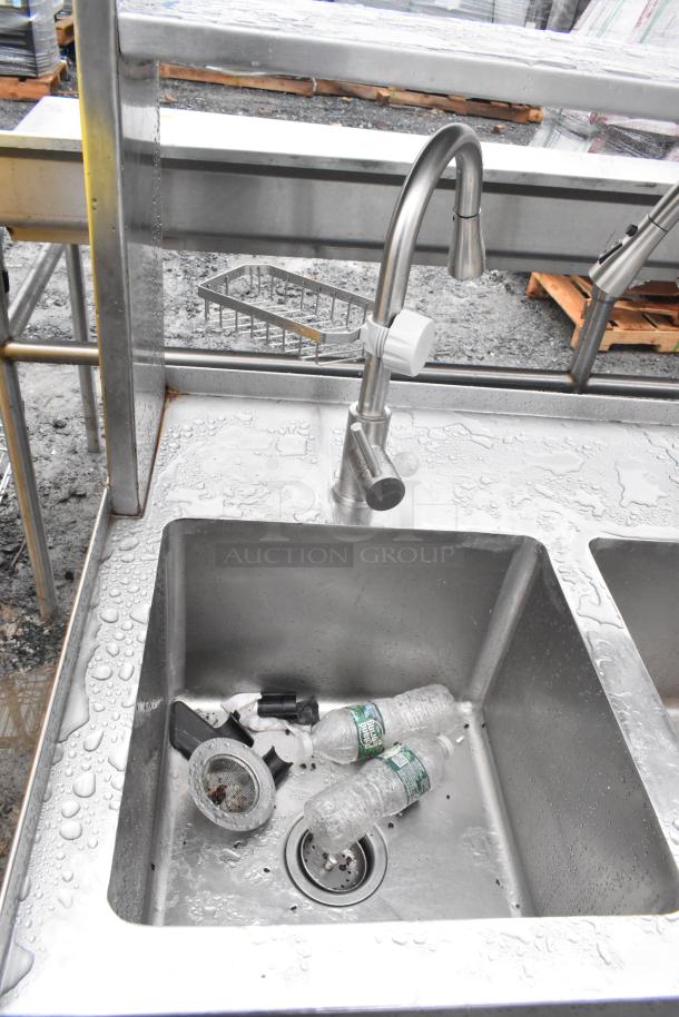 Commercial prep station with three-bay sink, single-bay hand sink, under shelves, and over shelf. Stainless steel, visible wear.