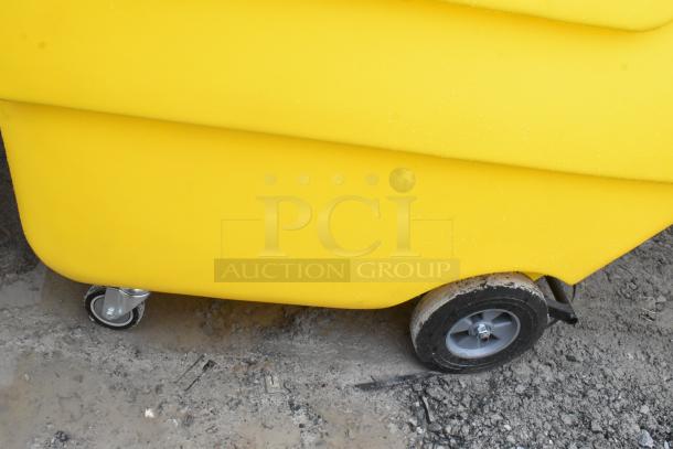 Lavex 475UTT10HNDL yellow poly tilt truck, 1 cubic yard capacity. Features durable wheels, ideal for industrial use.