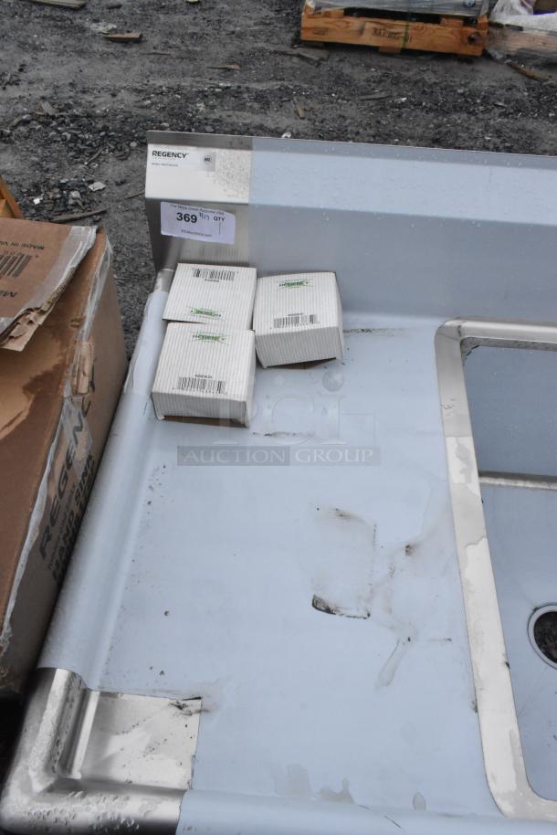 BRAND NEW, scratch and dent Regency 600S31824218 commercial 3 bay sink, visible packaging, some surface markings.