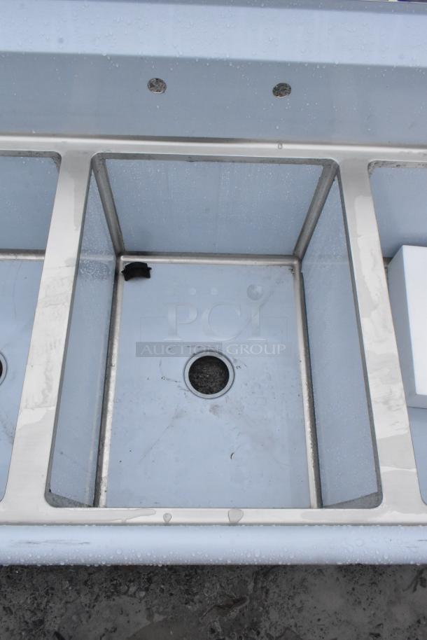 Brand new Regency 600S31824218 commercial 3 bay sink, stainless steel, minor cosmetic scratches, no major dents visible.
