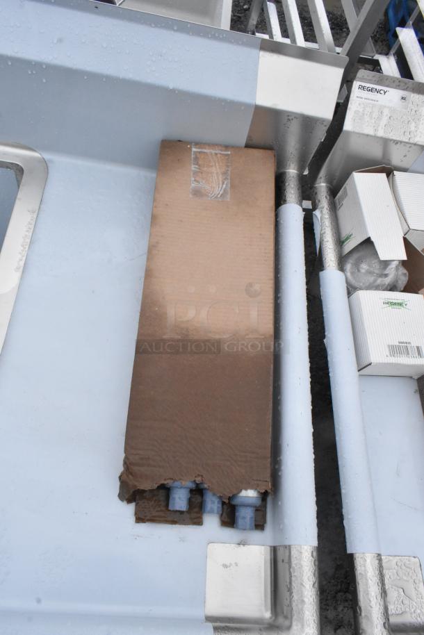 Regency 600S31824218 Commercial 3 Bay Sink, brand new with minor scratches and dents. Includes packaging, visible labels.