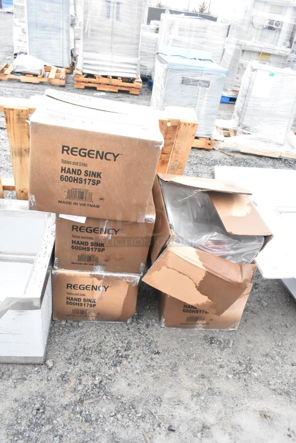 5 new Regency 600HS17SP hand sinks in boxes, some with visible dents. Includes gooseneck faucet and side splash.