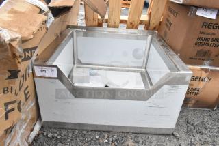 Brand new Regency 600SM242412N mop sink, 16-gauge stainless steel, 24"x24"x12" with notched front, minor scratches visible.